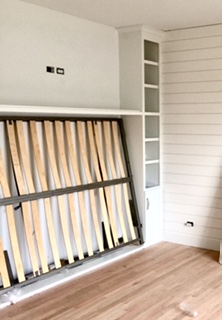 Office with shiplap and in-wall bed